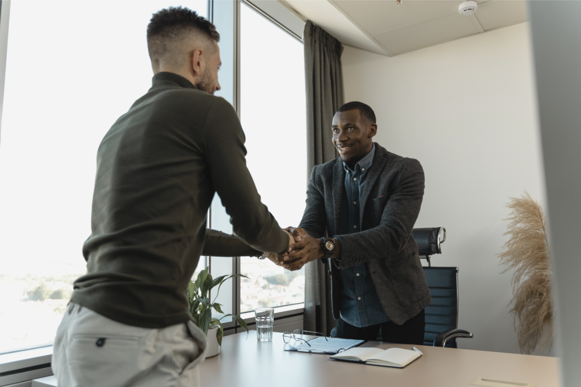 interviewer shaking hands with an interviewee